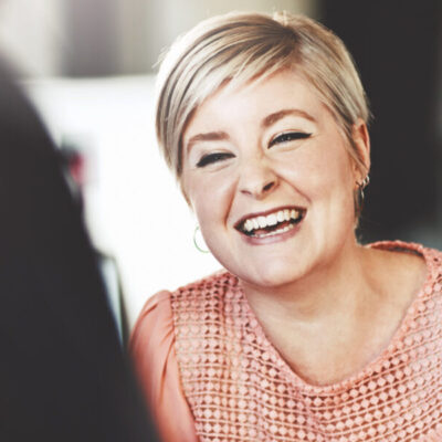 Business woman enjoying a discussion about coaching solutions